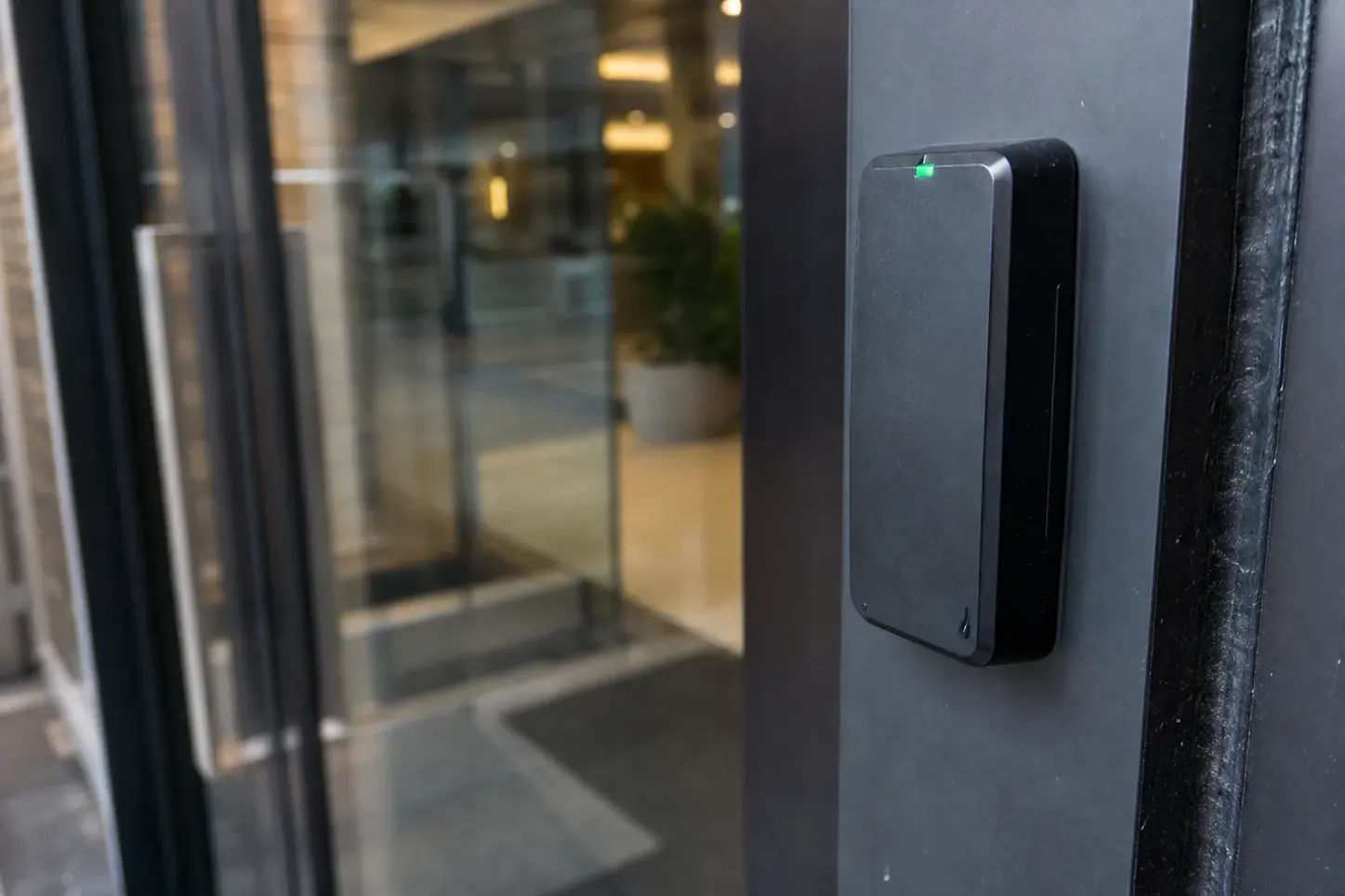 Access control card reader beside an office door